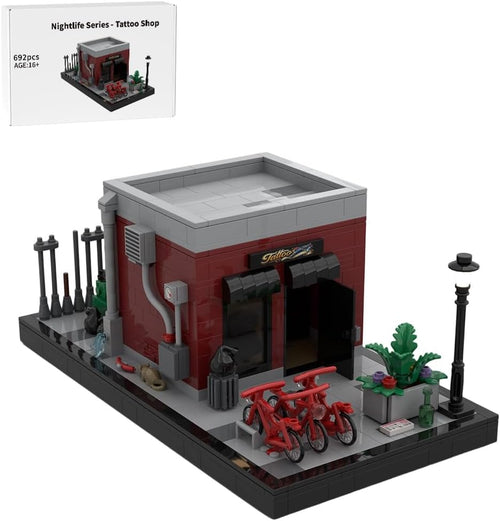 Brick-built tattoo shop storefront with street lamps, bikes and back alley