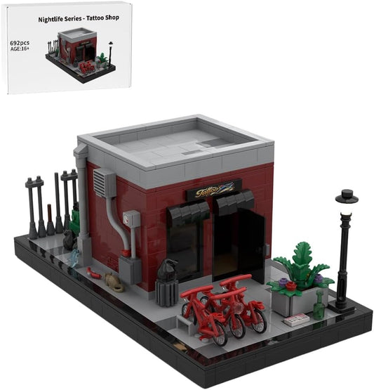 Brick-built tattoo shop storefront with street lamps, bikes and back alley