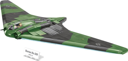 Built WWII flying-wing aircraft brick model on a presentation plate with pilot figure