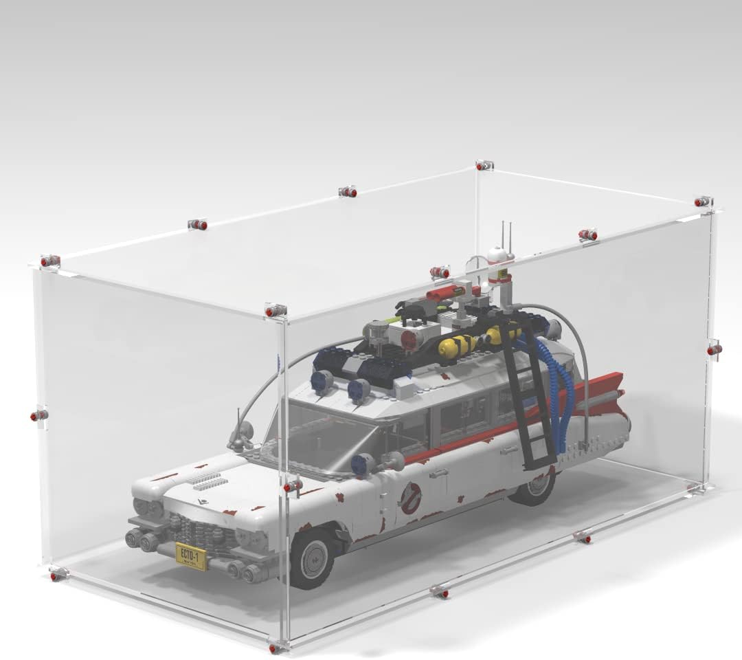 Clear display case with brick-built base holding a white vintage ambulance car model