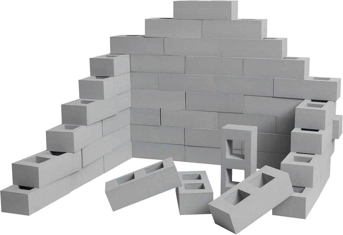 Red faux-brick foam building blocks with square and circle holes stacked into a wall – view 2