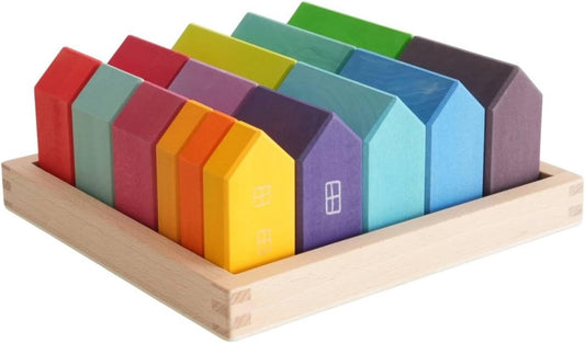 Painted wooden house blocks with printed doors and windows in a wooden tray