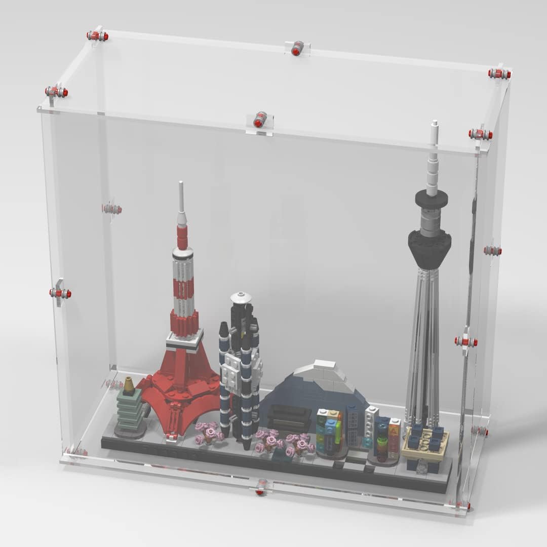 Clear display case with brick-style frame around a Tokyo skyline model