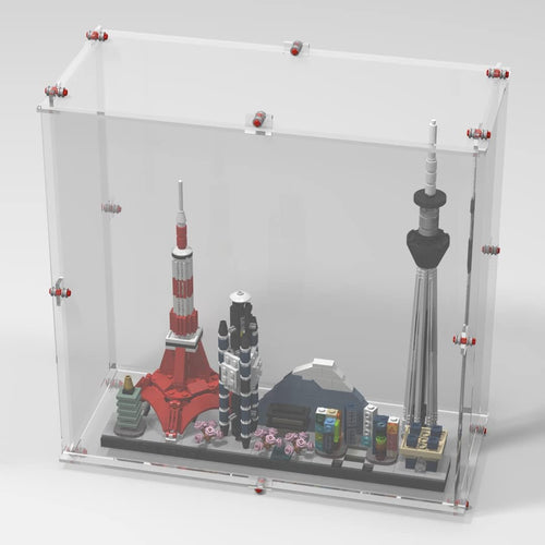 Clear display case with brick-style frame around a Tokyo skyline model
