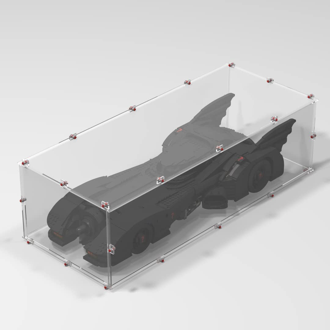 Brick-framed display case with clear panels around a large superhero car model