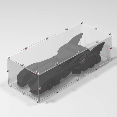 Brick-framed display case with clear panels around a large superhero car model