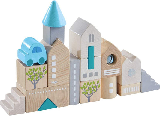 Natural and colored beech wood building blocks stacked into a small tower