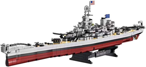 Brick-built WWII battleship with gun turrets and lifeboats on a display base
