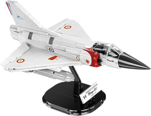 Silver brick delta-wing jet fighter on a display stand with pilot figure