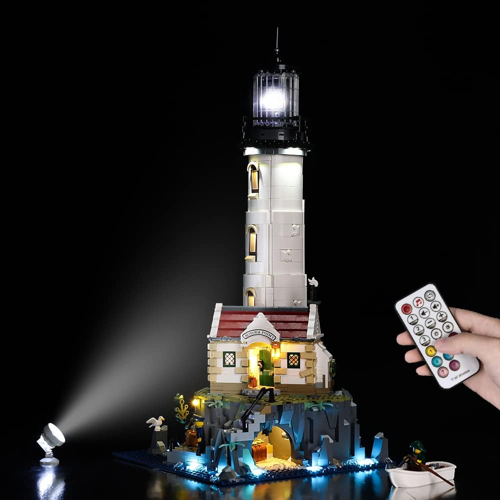 Brick-built lighthouse on a rocky base lit by LED lights at night