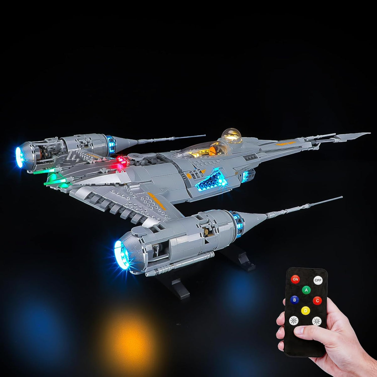 Silver starfighter brick model with glowing LED engines and cockpit