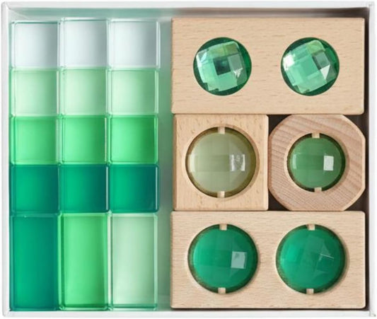 Stacked wooden blocks with translucent green acrylic pieces and round lenses