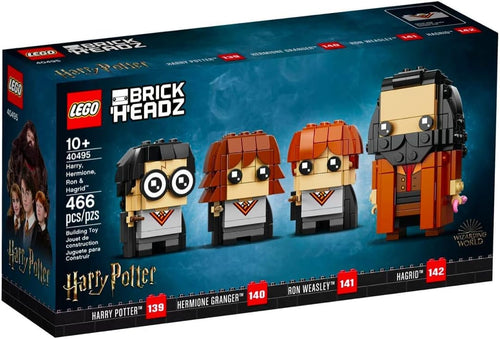 Four chunky brick character figures of young wizards and a bearded gamekeeper