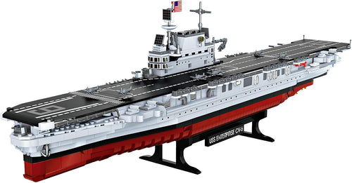 Brick-built grey WWII aircraft carrier with long flight deck and island tower