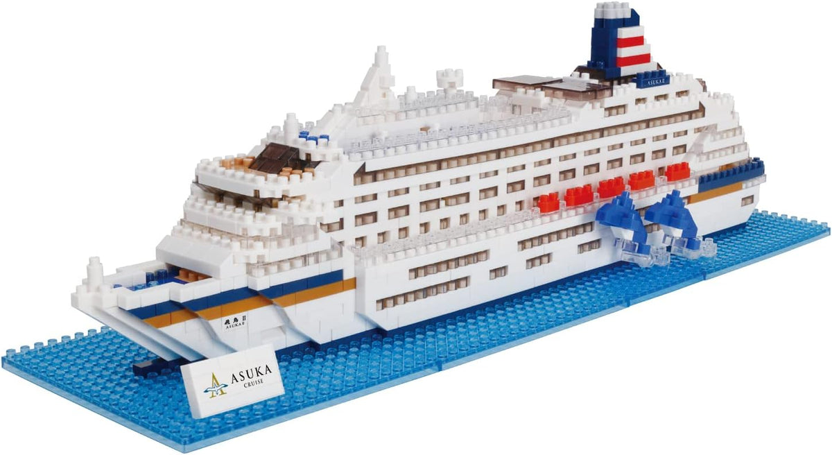 Tiny white micro brick cruise ship model with layered decks and funnel