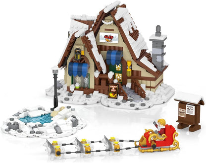 Built snowy holiday bakery with red awning, fountain and snack stand – view 2