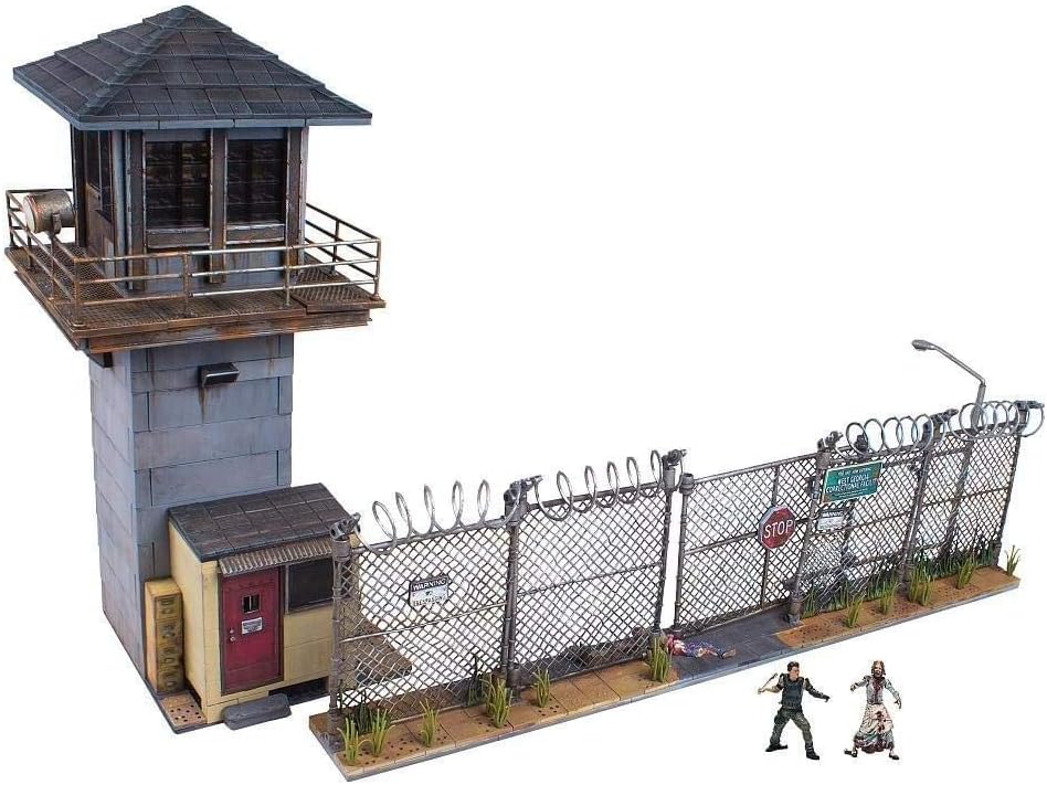 Brick-built prison guard tower and gate with barbed wire fence and zombie figures