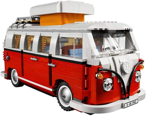 Brick-built vintage camper van with split front window and plaid curtains