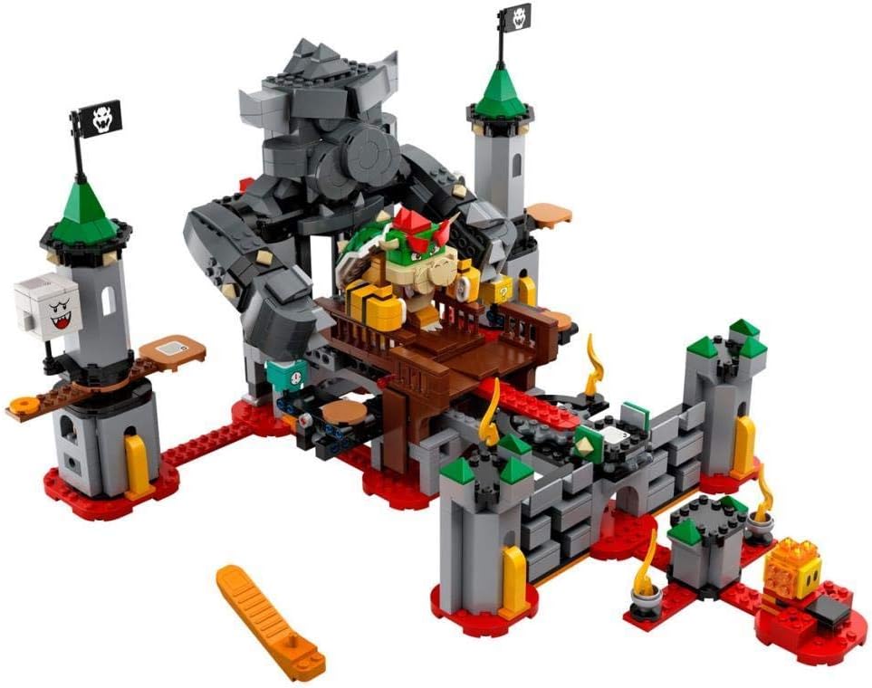Brick-built boss castle with towers, rotating platforms and enemy figures