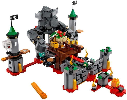 Brick-built boss castle with towers, rotating platforms and enemy figures