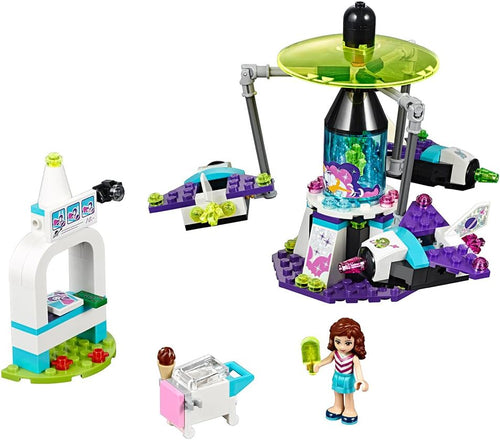 Brick-built spinning rocket ride with photo booth and ice cream stand
