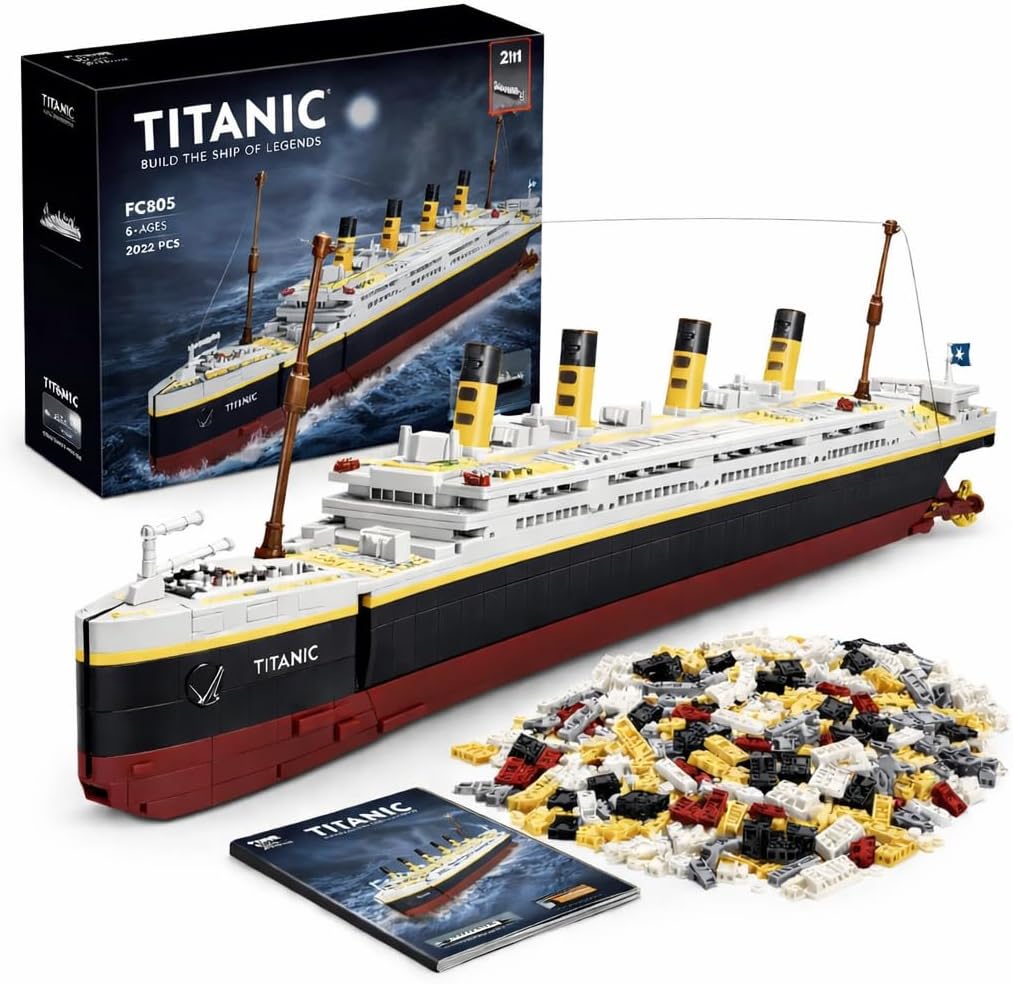 Black and white brick-built four-funnel ocean liner on a rolling display base