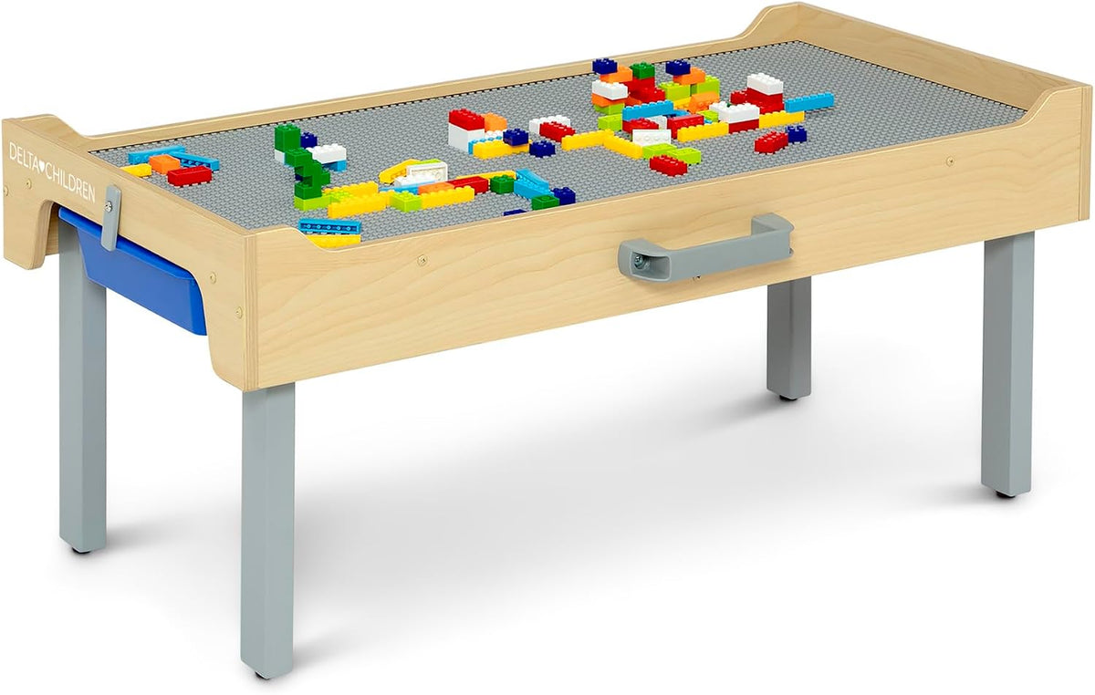 Grey folding kids play table with a brick-plate top and colorful building bricks