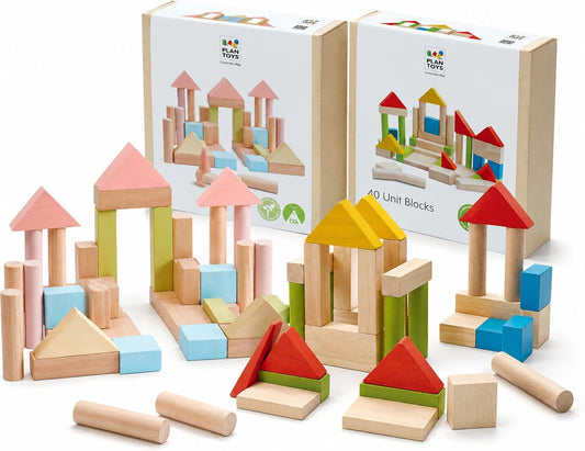 Wooden unit blocks in pastel and natural wood stacked into a bridge