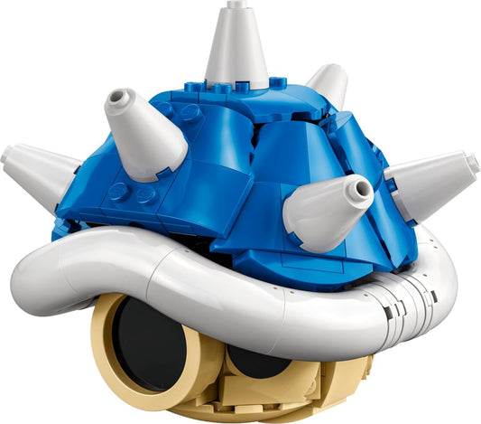 Built blue and white spiked shell brick display model on a desk