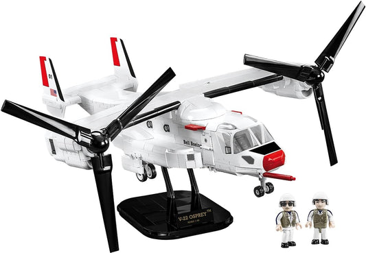 Gray brick tiltrotor aircraft with large rotors on each wing tip