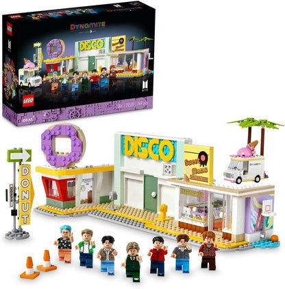 Brick-built disco stage with seven band figures holding microphones and a small donut shop – view 2