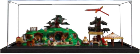 Wide clear acrylic display case covering a green hillside village brick model with round doors