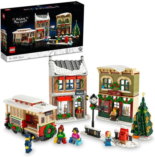 Snowy brick main street with toy store, music store and a streetcar at Christmas