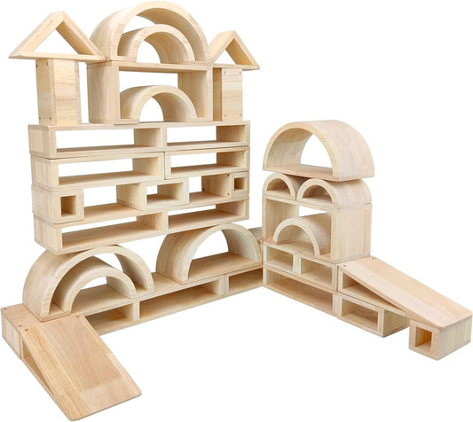 Large hollow wooden blocks stacked into a low wall and tower