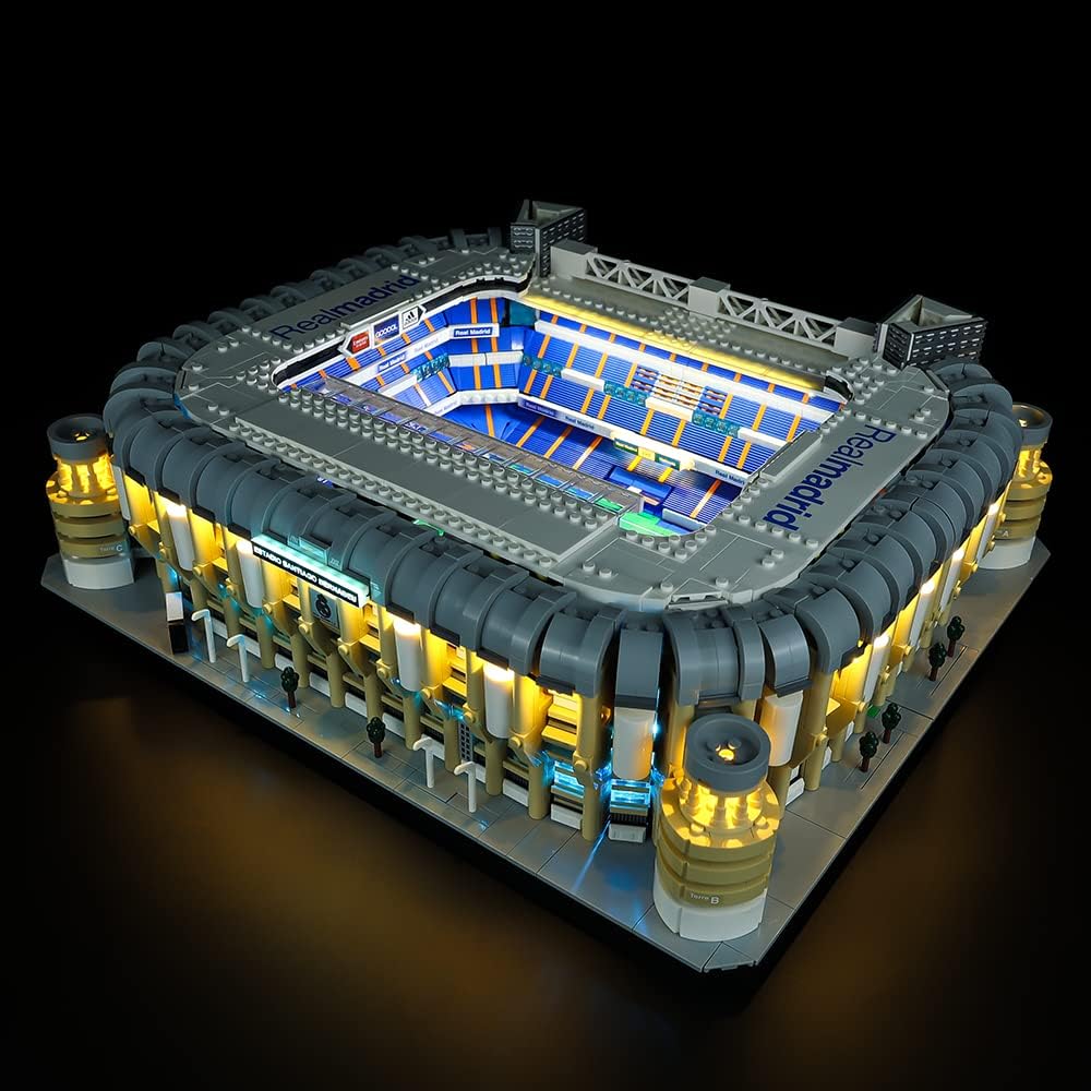 Brick-built soccer stadium lit by white floodlights and colored LED strips around the stands – view 3
