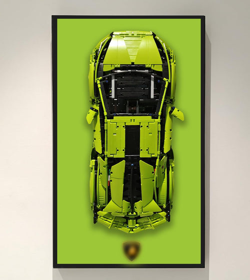 Wall-mounted display frame holding a large technical supercar brick model