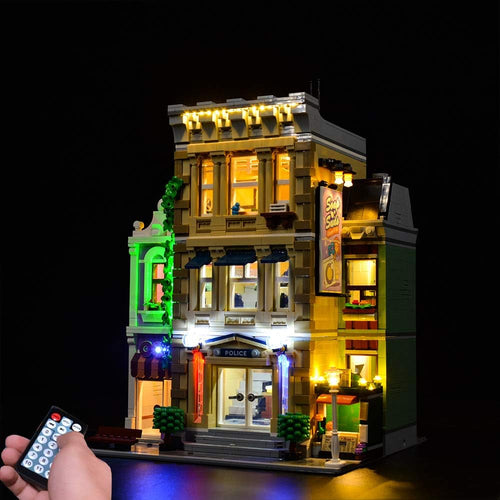 Police station brick model glowing with installed LED lights at night