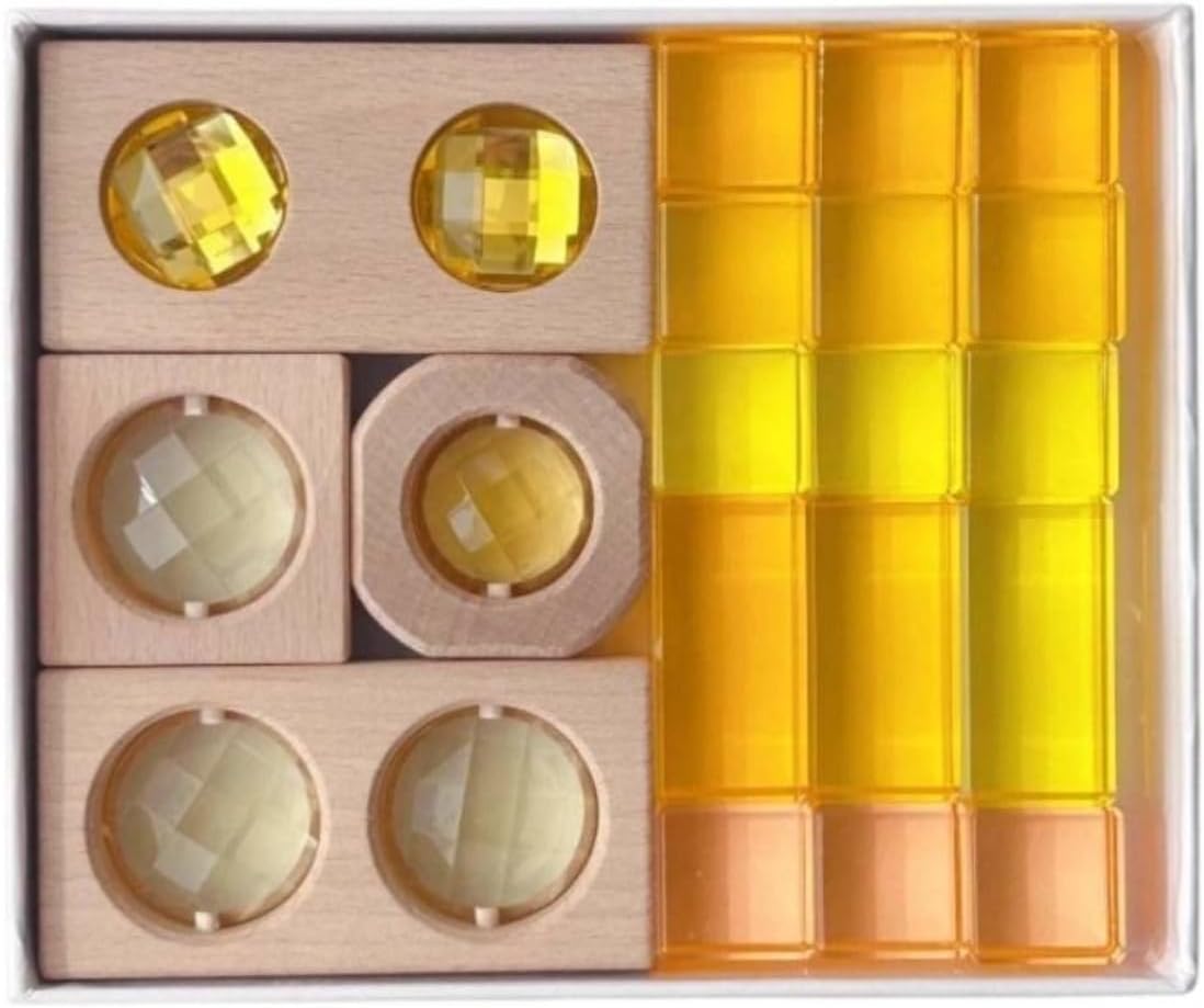 Wooden blocks with glowing yellow acrylic insets on a light table