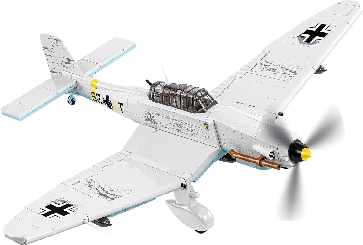 Brick-built WWII dive bomber aircraft model on a transparent display rod with two pilot figures
