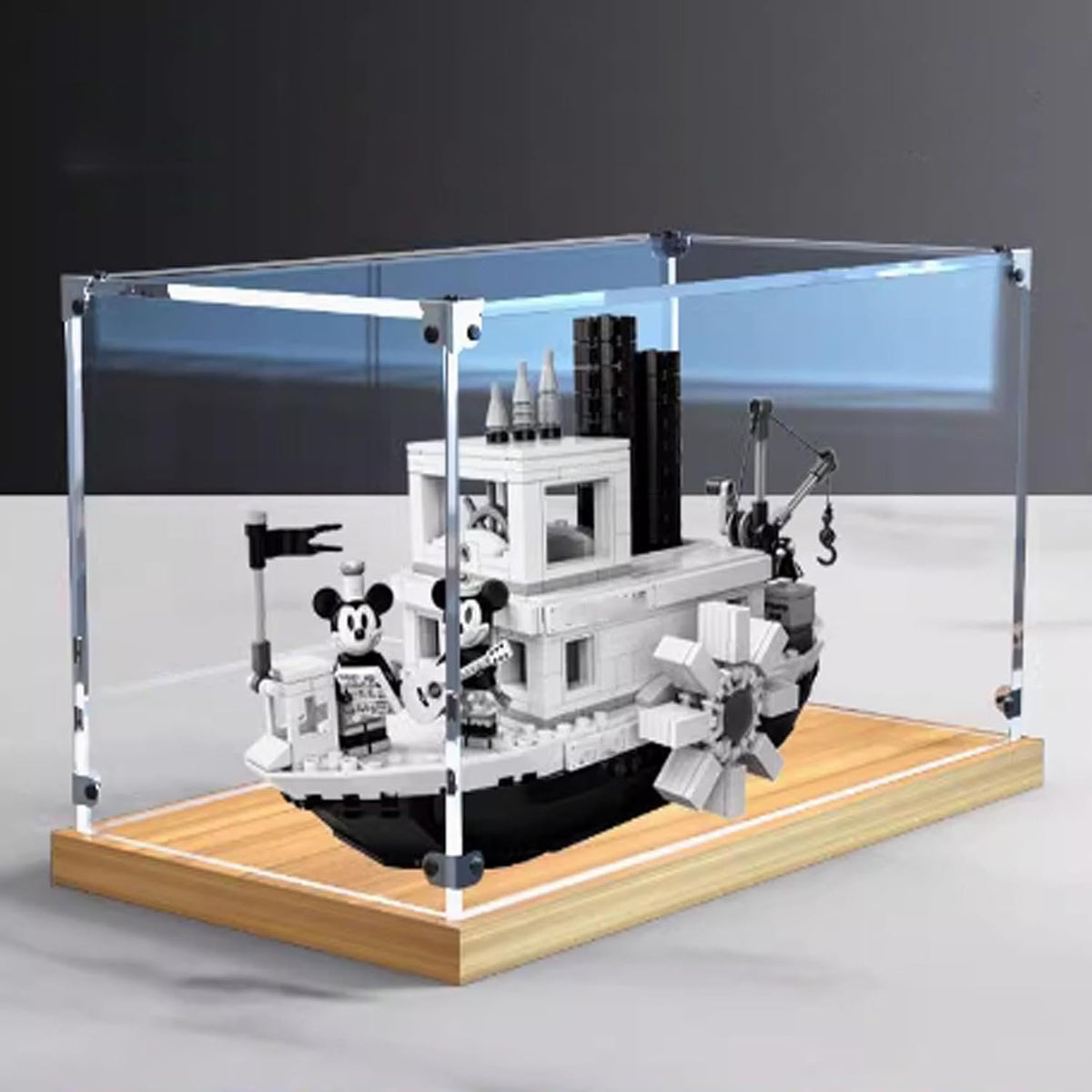 Clear acrylic case on a gold oak base displaying a steamboat brick model