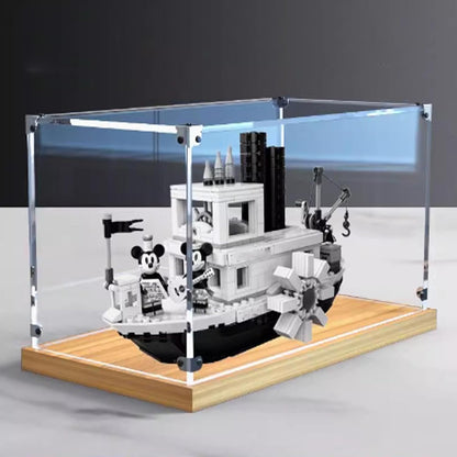 Clear acrylic case on a gold oak base displaying a steamboat brick model