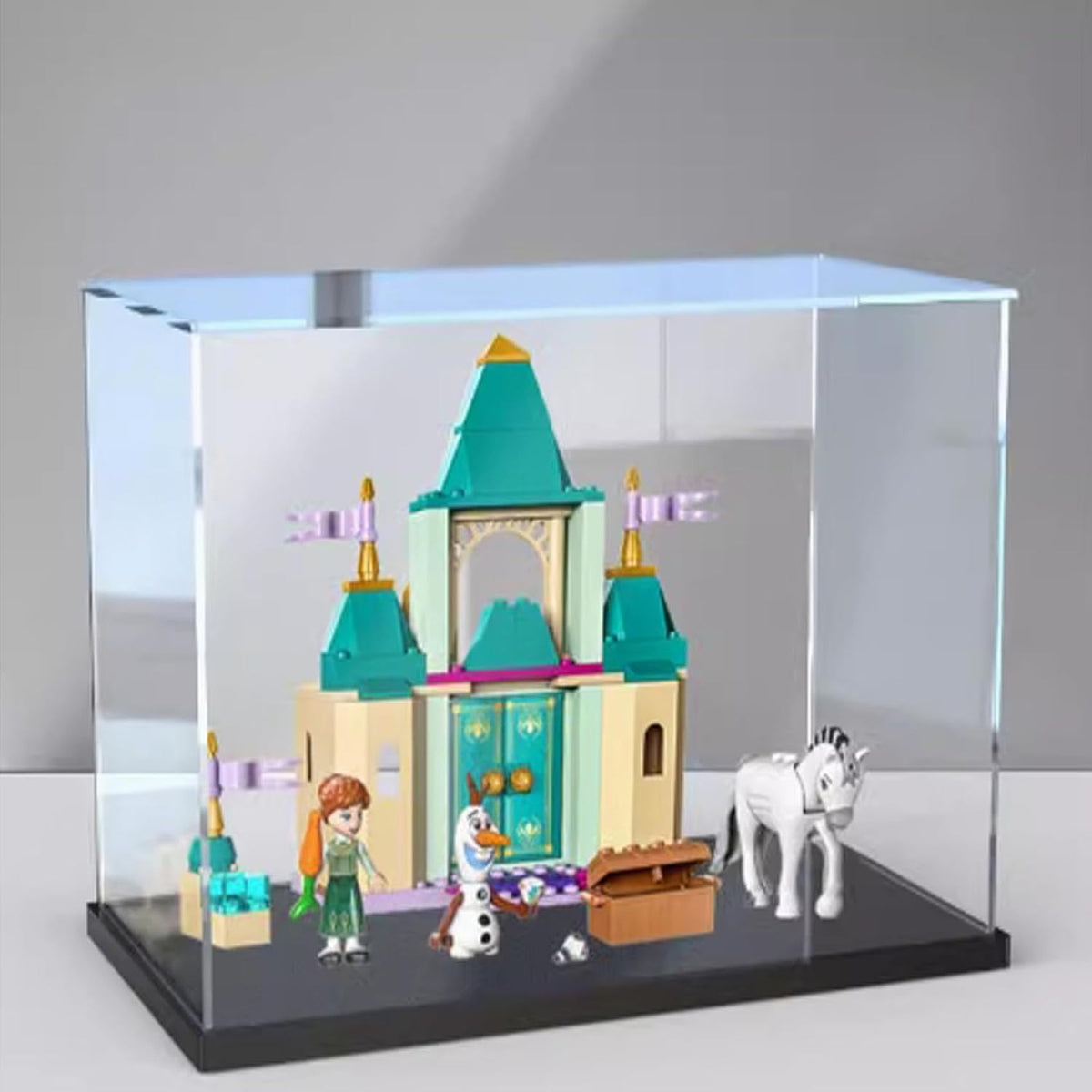 Clear acrylic display case with printed backdrop around a small castle model – view 2