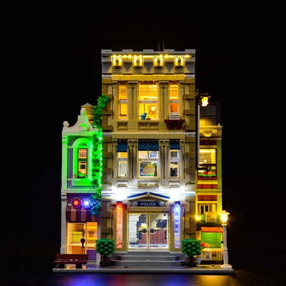Police station brick model glowing with installed LED lights at night – view 3