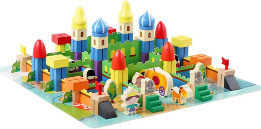 Wooden medieval castle and village pieces arranged on a base board
