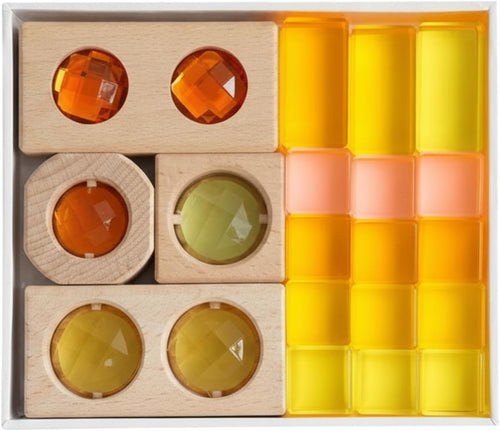 Wooden blocks stacked with translucent yellow acrylic geometric shapes