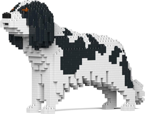 Brick-built Cavalier King Charles Spaniel sculpture sitting upright in brown and white