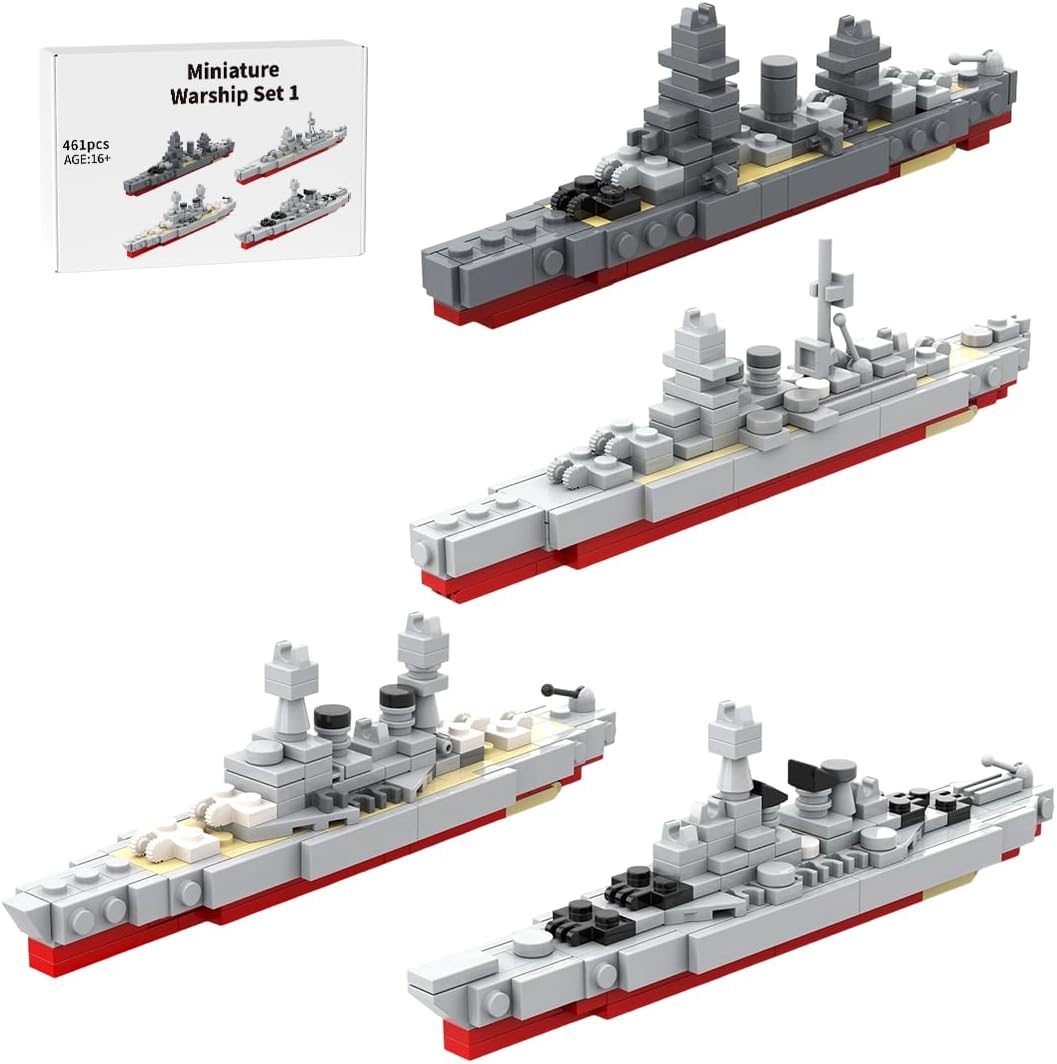 Four small brick-built gray battleship models lined up side by side