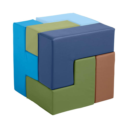 Seven soft earth-tone puzzle building blocks stacked on a classroom floor