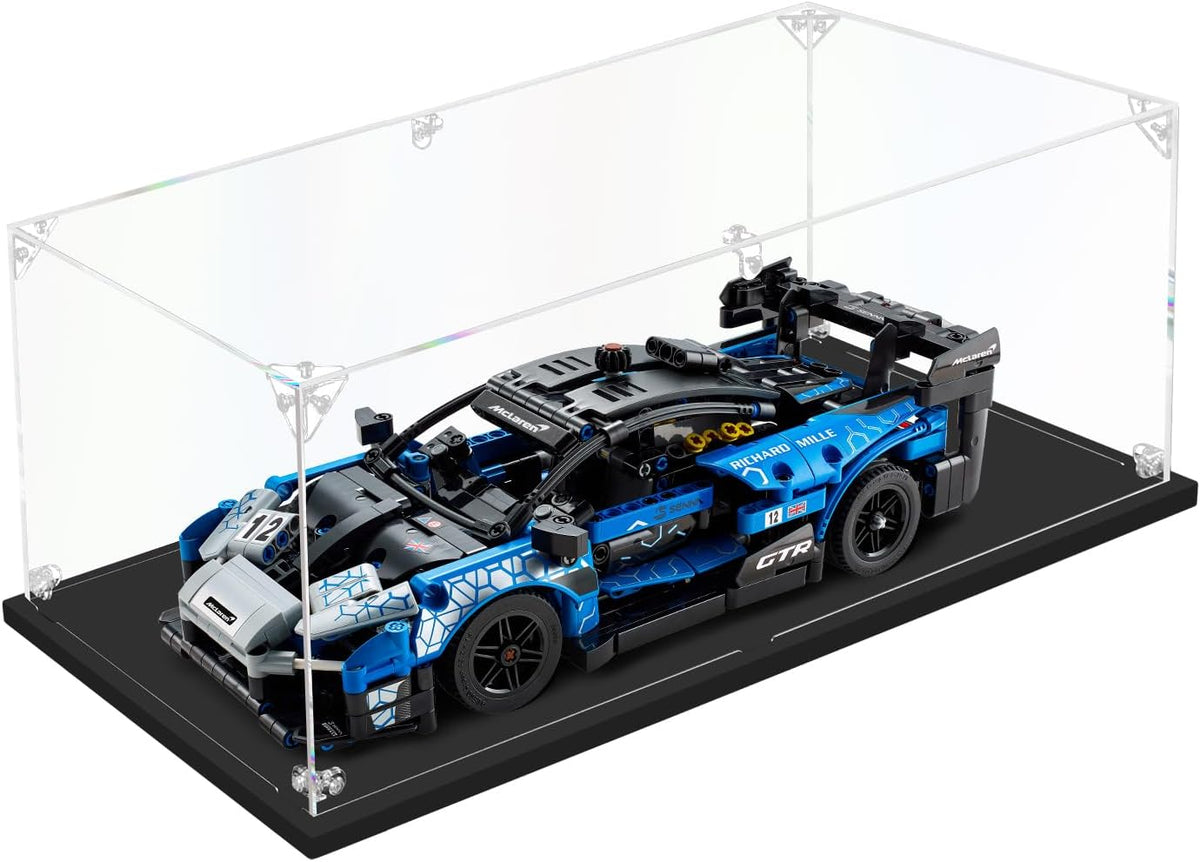 Clear acrylic display box holding a round superhero shield brick model – view 10