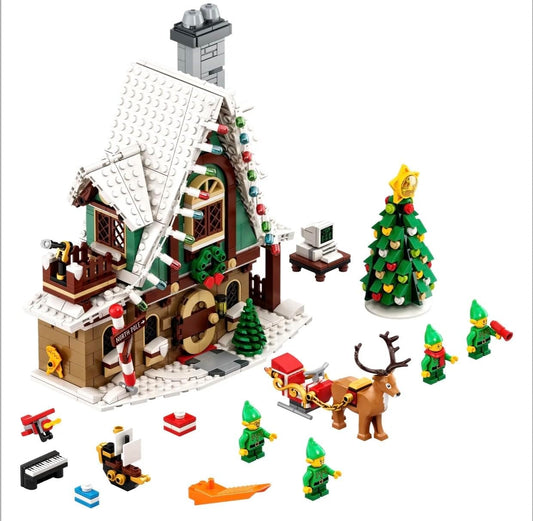 Built snowy holiday post office with Santa figure, elves and hot-air balloon